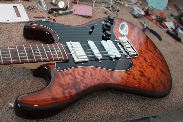 http://xhefriguitars.com/Stuff/FlameCustomBuild2011/Build%201%20Finish/ULTRA%20FINISHED1.jpg