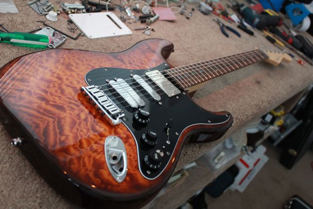 http://xhefriguitars.com/Stuff/FlameCustomBuild2011/Build%201%20Finish/ULTRA%20FINISHED6.jpg